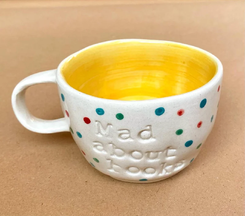 Transparent plastic party cups-Mad about books wobbly mug in yellow. These mugs are hand built so each mug will be different in its crookedness and wobbliness. No two are the same.