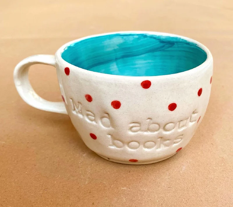 Heavy glass beer tumblers-Mad about books wobbly mugs in aqua. These mugs are hand built so each mug will be different in its crookedness and wobbliness. No two are the same.