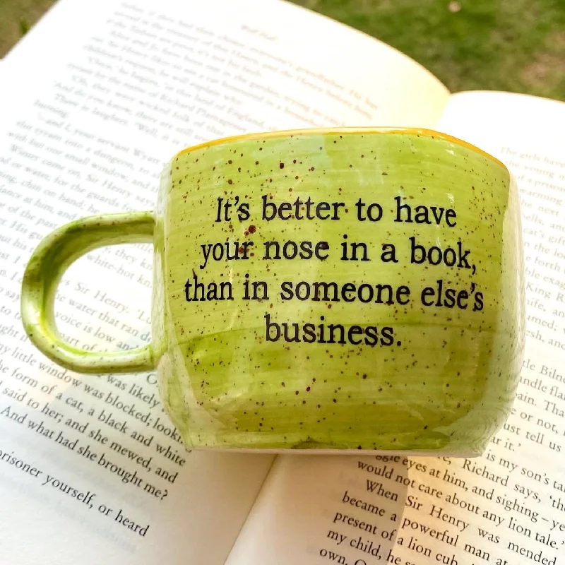 Personalized family mugs-Nose in book wobbly mug in lime green. These mugs are hand built so each mug will be different in its crookedness and wobbliness. No two are the same.